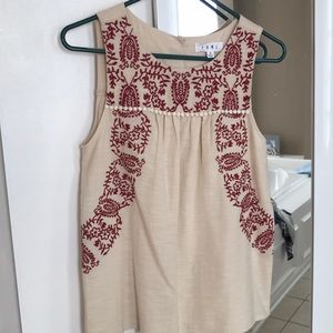 Sleeveless cream top with burgundy embroidery